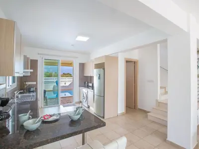 a kitchen with a counter top in a room at Holiday Home 3-Schlafzimmer-Villa mit privatem Pool by Interhome in Protaras