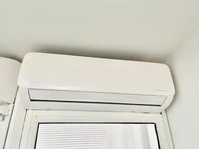 a white door with a window in a room at Silver Blu APT - Beachside - Location - Office in Limassol