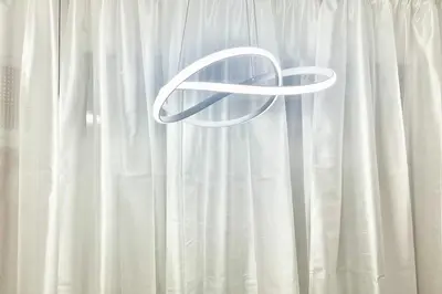 a white curtain with a white ribbon on it at Silver Blu APT - Beachside - Location - Office in Limassol