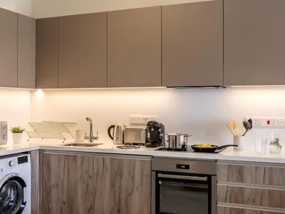 a kitchen with a stove and a dishwasher at Mythical seas 004 in Paralimni