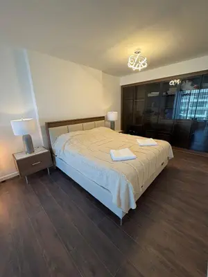 a bedroom with a bed with two towels on it at Super Luxury 1 bedroom apartment on 27th floor in Grand Sapphire in Phrenaros