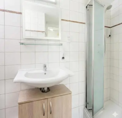 a bathroom with a sink and a shower at Fig Tree Beach Villa Five in Protaras