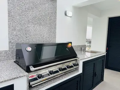 a microwave sitting on a counter in a kitchen at Makenzie View Penthouse in Larnaka