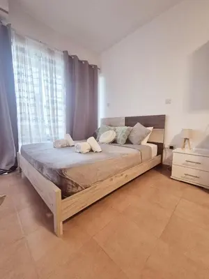 a bedroom with a large bed in a room at Olive studio in Limassol