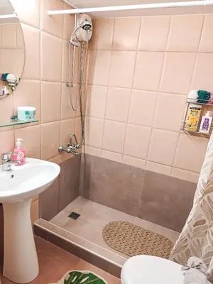 a bathroom with a shower and a sink at Olive studio in Limassol