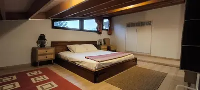 a bedroom with a bed and a window in it at The Zephyr House -2- in Pyrgos