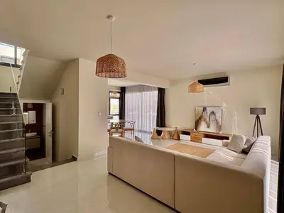a living room with a large couch and a table at Bohemian City Escape Villa in Nicosia