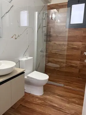 a bathroom with a toilet and a shower and a sink at Bohemian City Escape Villa in Nicosia