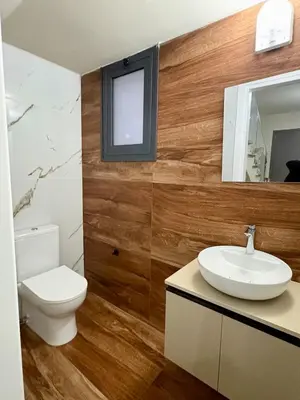 a bathroom with a toilet and a sink and a mirror at Bohemian City Escape Villa in Nicosia