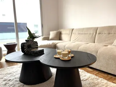 a living room with a coffee table and a couch at STAY Aelia Apartment in Nicosia