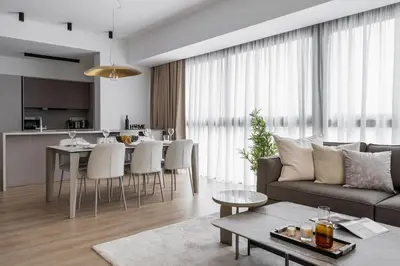 a living room with a couch and a table at Aoki 3-Bedroom Luxury Apartment in Limassol