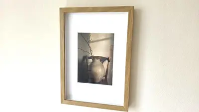 a picture of a vase in a frame on a wall at Warm Design 3BR, Beach 7-min walk, Peaceful in Larnaka