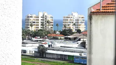 a view of a city with tall buildings and the ocean at 3BR Shared Apt - Beach 7-min walk, Peaceful in Larnaka