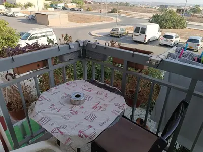 a table on a balcony with writing on it at 1 room at sharing flat in Larnaka