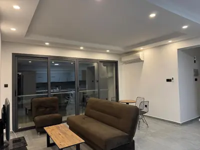 a living room with a couch and a table at 3 bed flat in Nicosia in Nicosia
