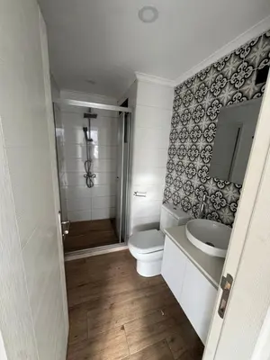 a bathroom with a toilet and a sink at 3 bed flat in Nicosia in Nicosia