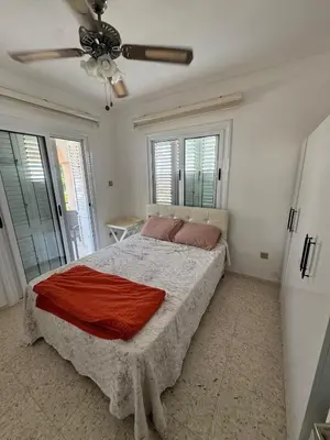 a bedroom with a bed and a ceiling fan at 3 bedroom Villa in Kyrenia, 2 minutes away from the beach! in Strovolos