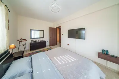 a bedroom with a bed and a sink in it at The Nissi Duo Collection in Ayia Napa
