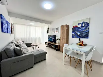 a living room with a couch and a table at STAY Blue House in Larnaka
