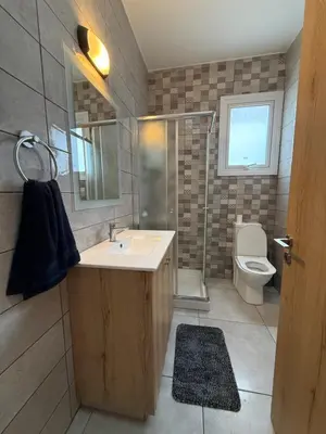 a bathroom with a sink and a toilet at Ocean Breeze 2BR House in Paralimni