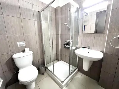 a bathroom with a toilet and a sink at STAY Tropical Apartment in Protaras