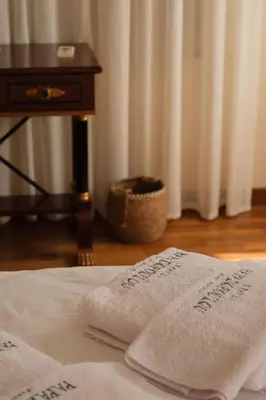 a pair of towels sitting on top of a bed at Epavli Papadopoulou - Luxury Villa - Pool & Garden in Kornos