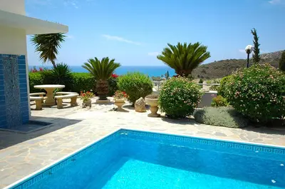 a swimming pool with a view of the ocean at Villa Acanthus in Pissouri