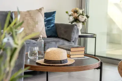 a hat on a coffee table in a living room at Protaras Hestia Seaside Villa A6 in Protaras
