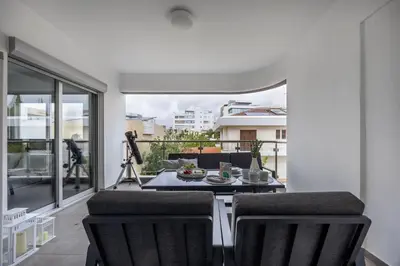 a balcony with a table and chairs on a patio at Vasileos Konstantinou Modern 2BR City Apartment with Balcony in Limassol