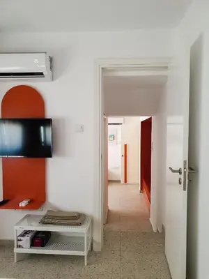 a hallway with a door leading into a room at Rainbow Apartments in Ayia Napa