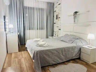 a bedroom with a bed with two towels on it at Sea view Remus Family 2 bdr apartment in Nicosia