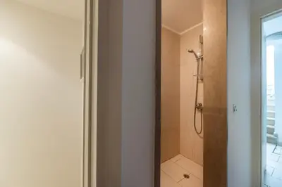 a bathroom with a shower with a glass door at Protaras Seafront Villa Galene Del Mar in Protaras
