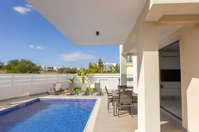 a swimming pool on the roof of a house at Protaras Sol e Mar Villa 2 in Protaras
