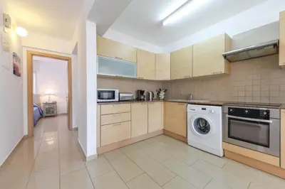 a kitchen with a washer and a dishwasher at Nissi Apartment #101 in Ayia Napa