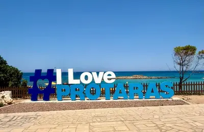 a sign that says i love venezuelas next to the ocean at Protaras Sol 2 Bedroom Holiday Let Apartment in Protaras