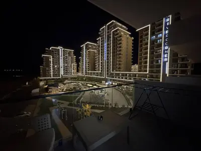 a view of a city at night from a building at Riverside Life residence in Long Beach, Iskele, North Cyprus in Dherinia