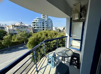 a balcony with a table and a view of a city at Kyrenia City Center Apartment in Kambia