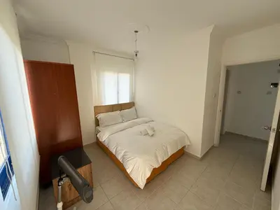 a small bedroom with a bed in a room at Girne KKTC in Anayia