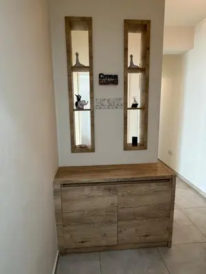 a room with three mirrors and a wooden dresser at 2bdr apt Turkish Side Nicosia in Nicosia