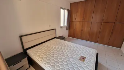 a bedroom with a bed with a piece of food on it at Limassol Great in Limassol