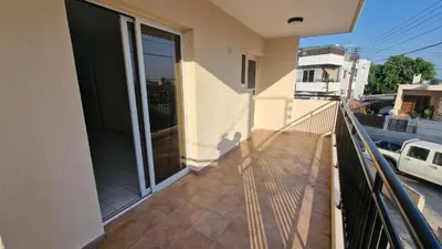 a balcony of a house with a glass door at Limassol Great in Limassol