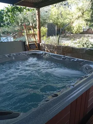 a jacuzzi tub in a backyard with at Ζεν σπίτι in Limassol