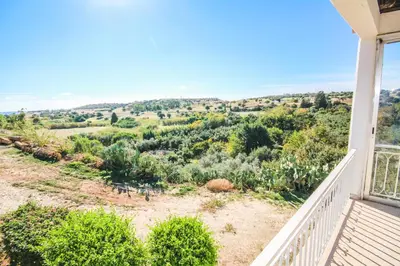 a view from the balcony of a house at Orchard View Cottage in Maroni