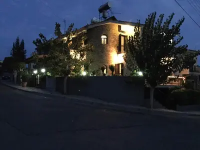 a building with lights on the side of a street at Nikola's House in Limassol
