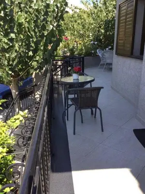 a patio with a table and chairs on a balcony at Nikola's House in Limassol