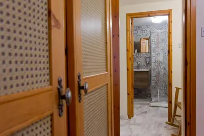 an open door to a room with a hallway at The Old Olive Mill House by TrulyCyprus in Doros