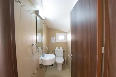 a bathroom with a toilet and a sink at Nancy Villas in Protaras