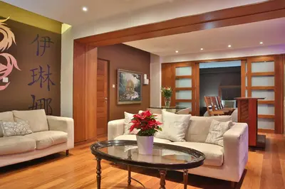 a living room with a couch and a table at Sofouli Suites in Nicosia