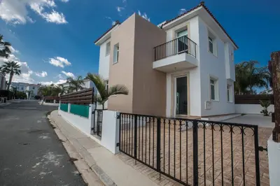a house with a fence in front of a street at Halle Villa in Protaras