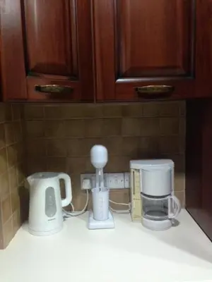 a kitchen counter with various appliances on a counter top at Galaria House in Moutoullas